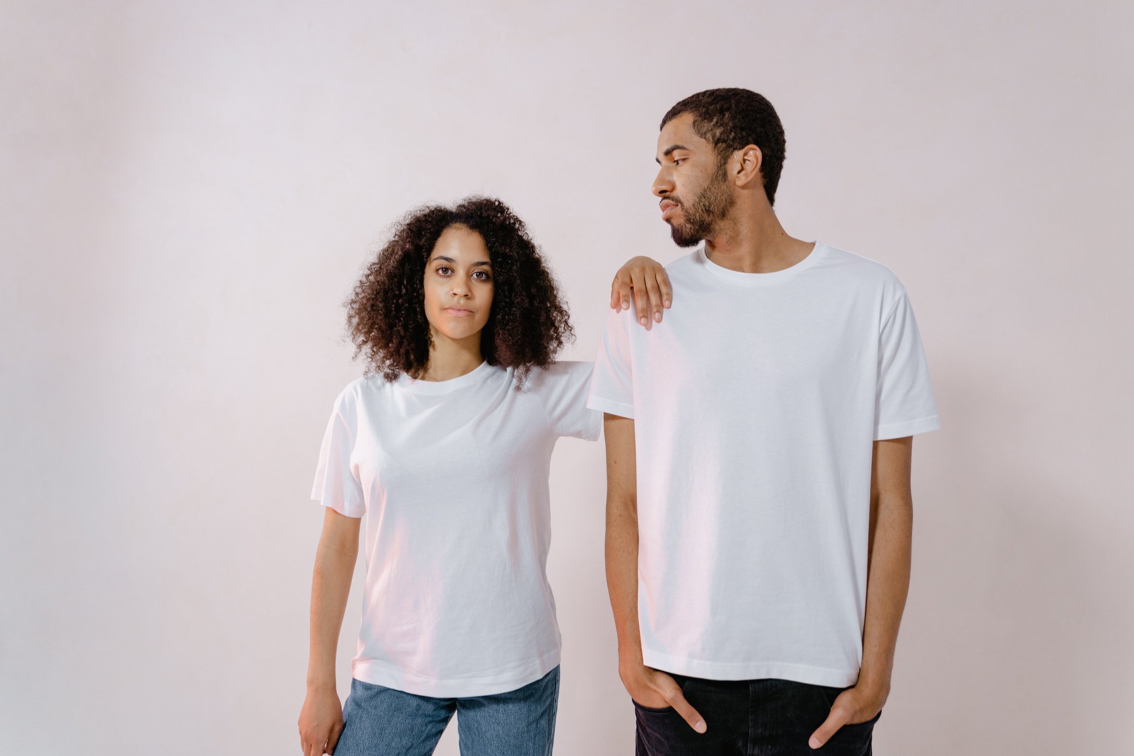 Man in White T-shirt Looking at Woman in White T-Shirt